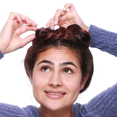 Repeat on opposite side, bringing the second braid over the top of the first