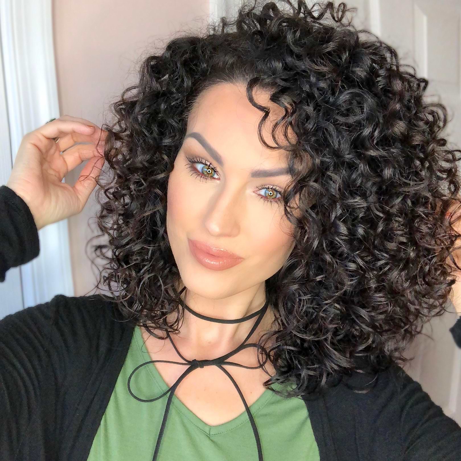 Woman with dark curly hair