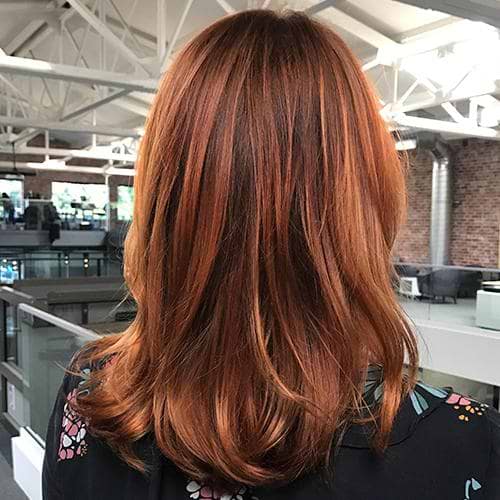 Light red hair enhanced with warm golden tones from Cannella Gloss
