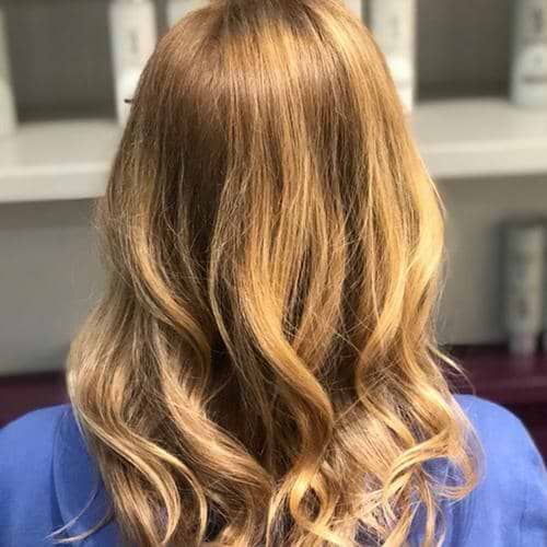 Sunkissed blonde hair with golden tones from Prosecco Gloss
