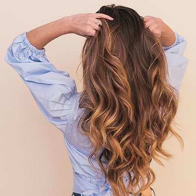 Woman with low maintenance summer hair color