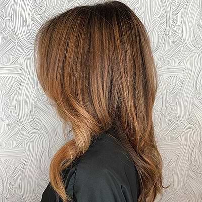 woman with brown hair with blonde highlights