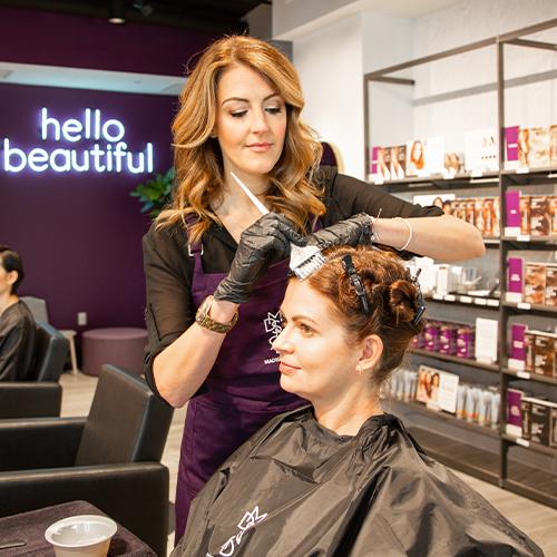 hair color applied to woman in Madison Reed Hair Color Bar