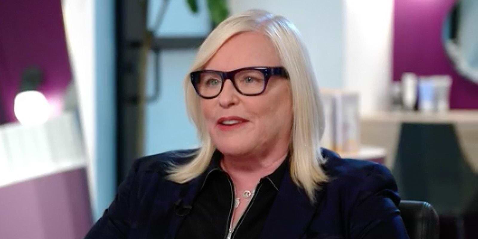 Woman with glasses smiling