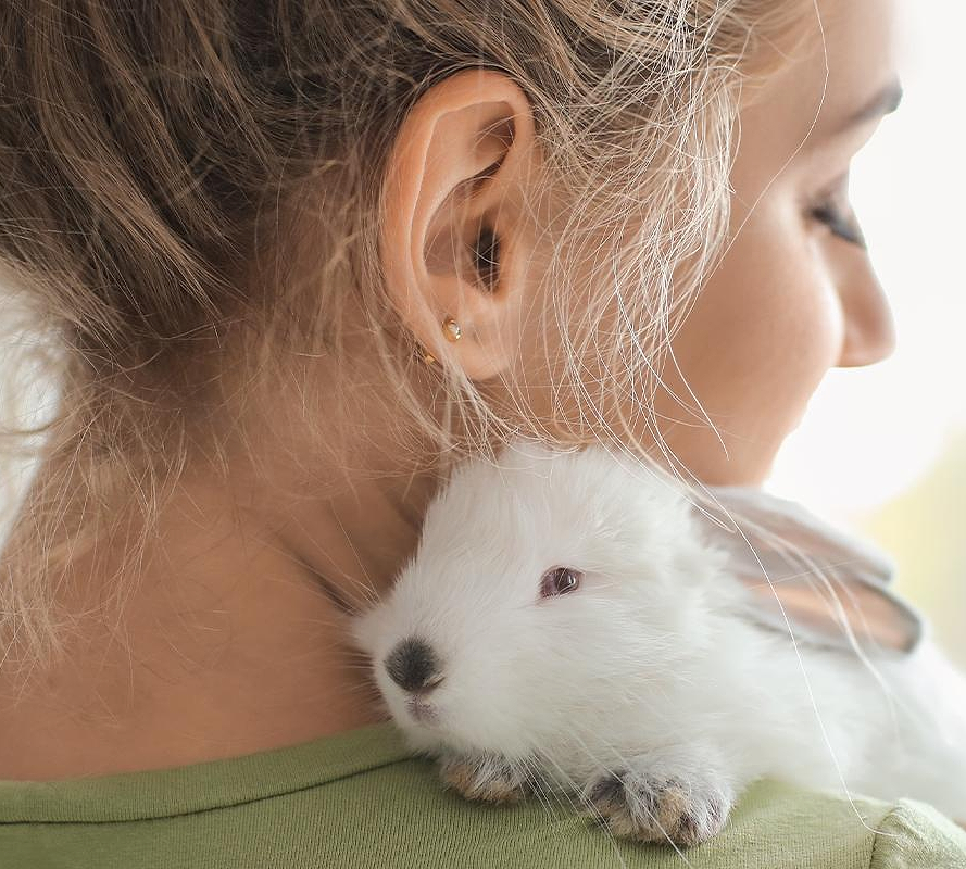 Bunny on woman's shoulder for Madison Reed's Leaping Bunny Certification