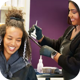 hair stylist applying highlights