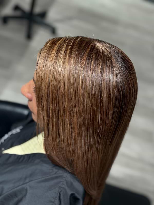 shiny hair partial foil highlight toned with Sorrento. Root touch up using 7.5NNA and sealed it all in with our fabulous Bonding Time Pro Treatment