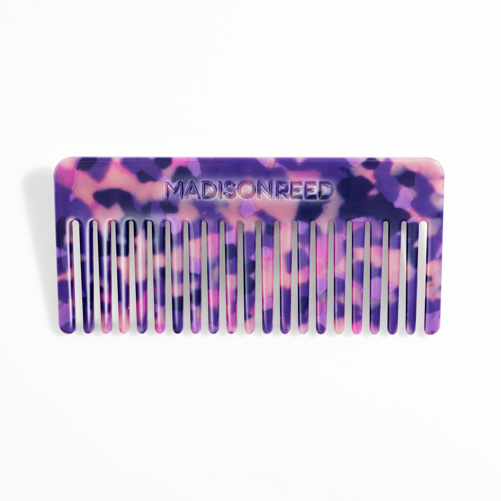 Wide tooth detangling comb in purple tortoise coloring