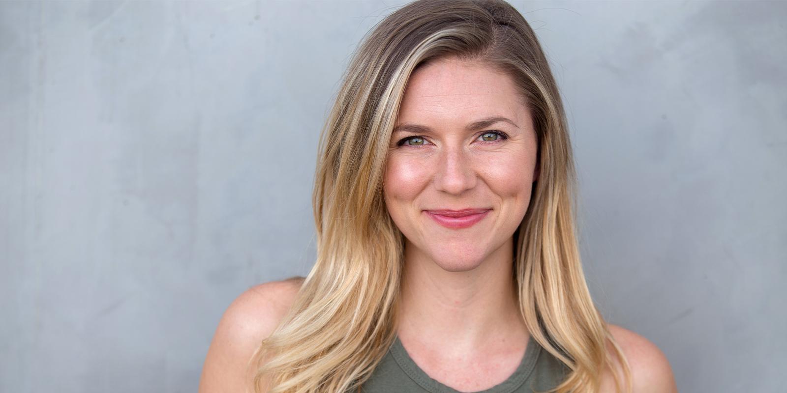 Woman with blonde highlighted hair smiling